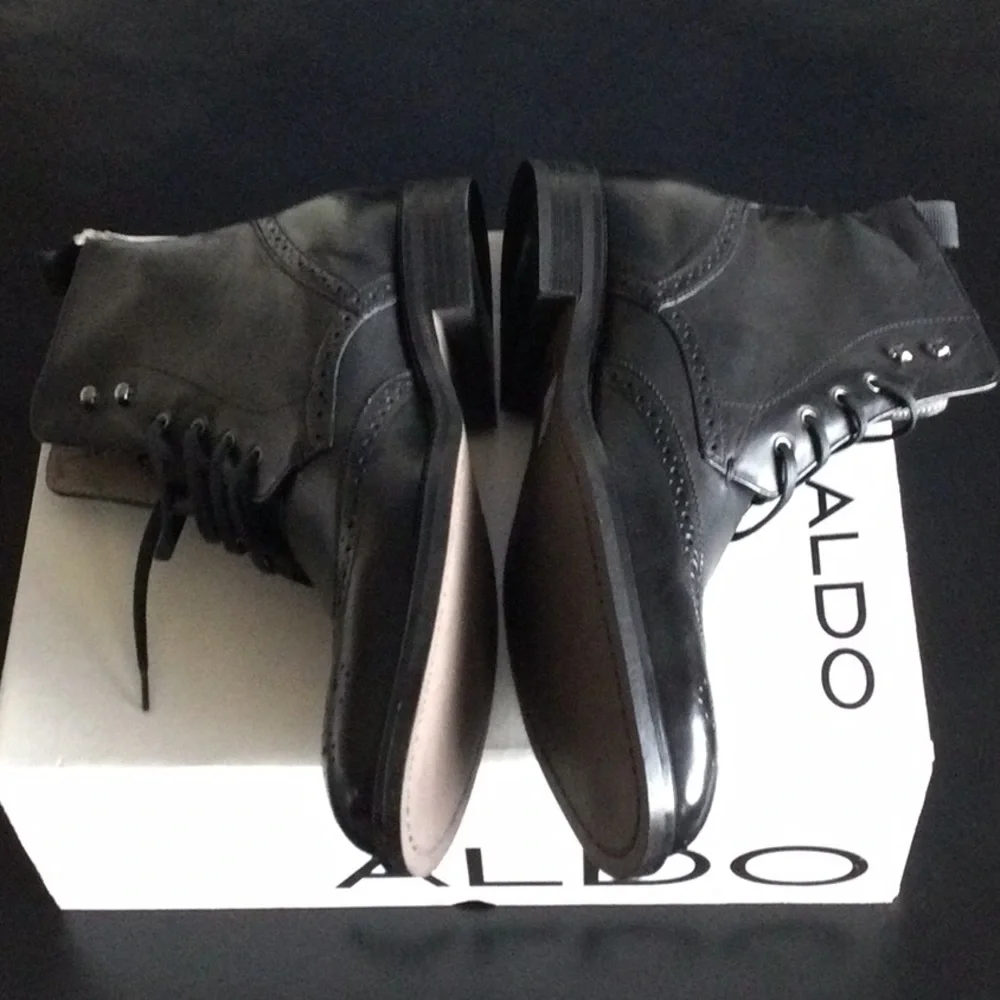 Wing tip dress boot